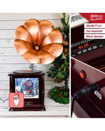 Grammofono natalizio con scena innevata luminosa